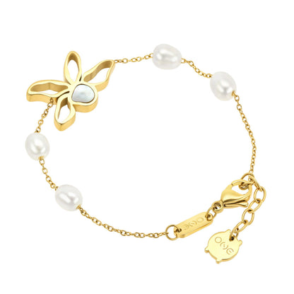Detail van de One Jewels armband met gouden bloem en parelaccenten.