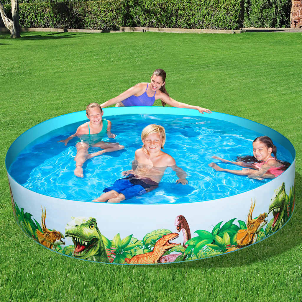 Kinderen spelen in het Bestway Dinosaur Fill'N Fun zwembad op gras.