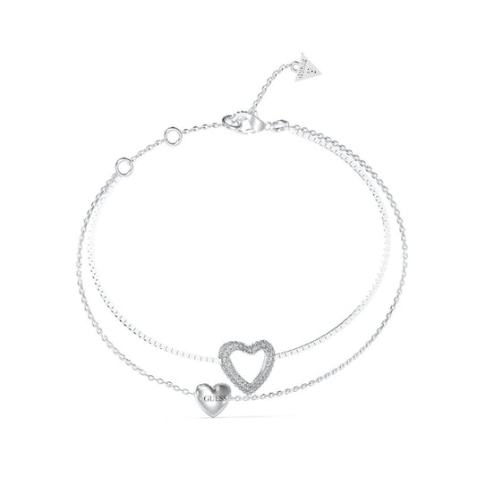 Zilverkleurige Guess armband voor dames met hartjesontwerp en glinsterende details.