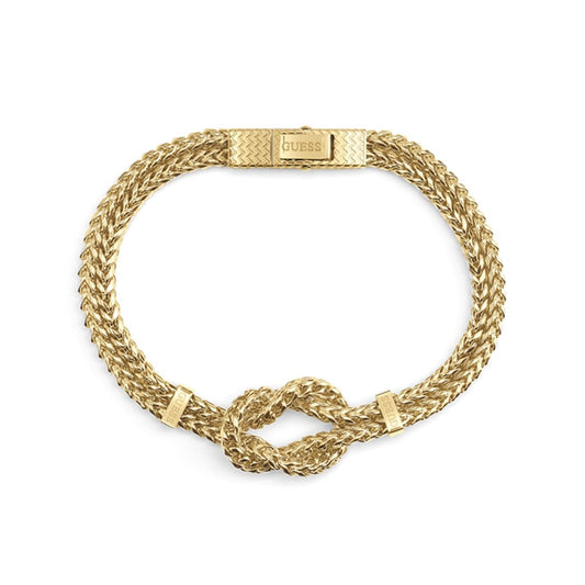 Gouden Guess armband voor dames met elegante afwerking en knoopdetail.