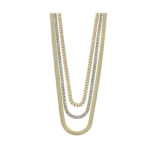 Lotus LS2342-1/2 damesketting met elegante gouden schakels en glinsterende details.