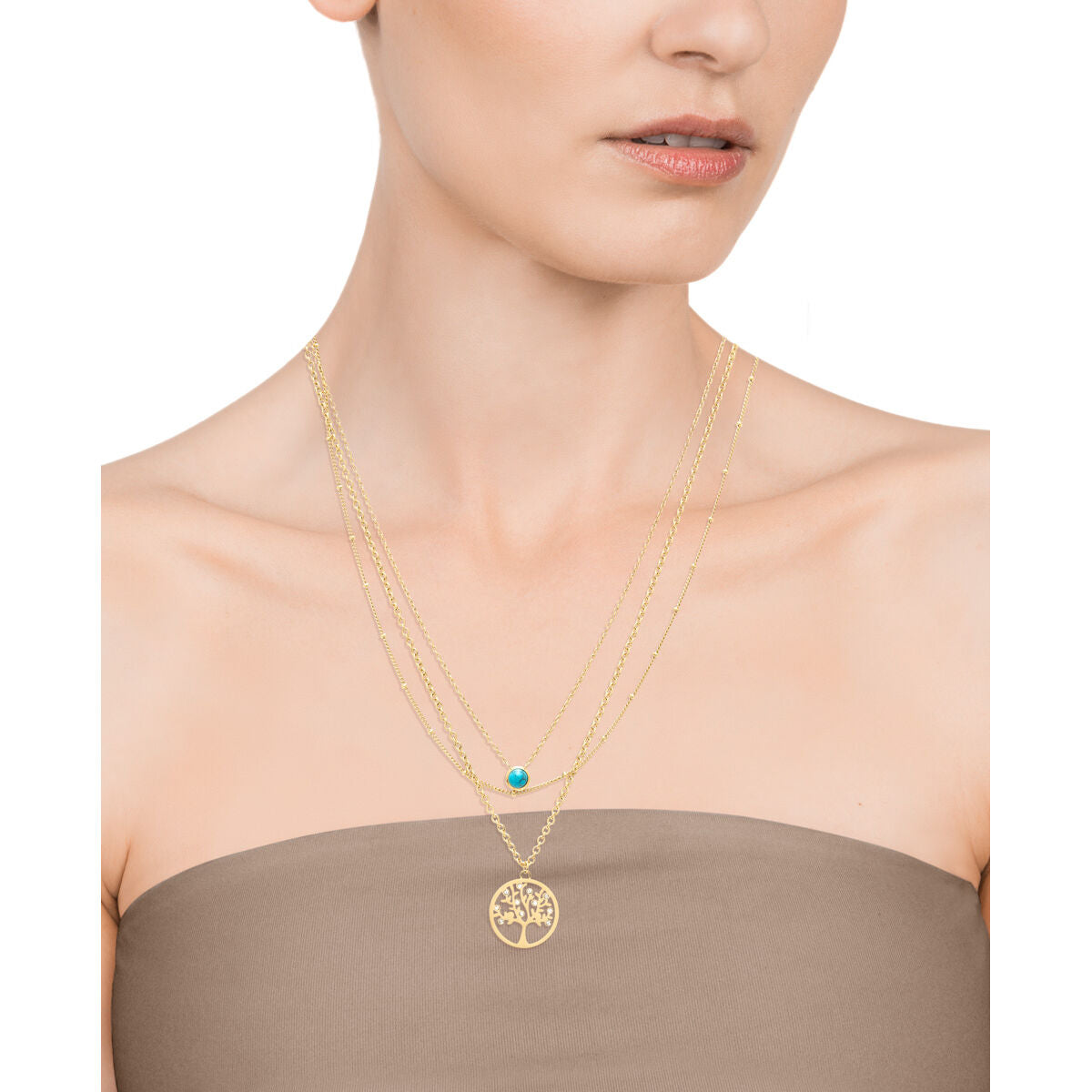 Detail van de Viceroy ketting met een gouden boomdesign en turquoise accent.