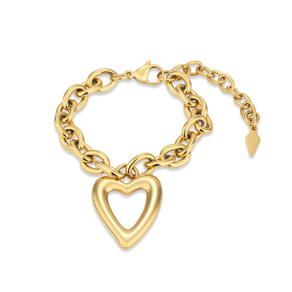 Gouden Radiant armband met hartvormige hanger en schakels, elegant design.