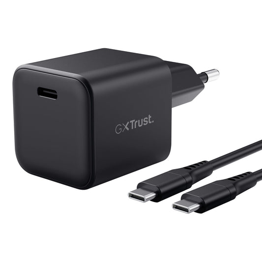 Zwarte Trust Wandlader 65W USB-C met bijbehorende kabel, compact ontwerp.
