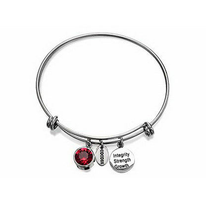 Zilverkleurige CO88 Collection armband met rode steen en bedels met teksten.