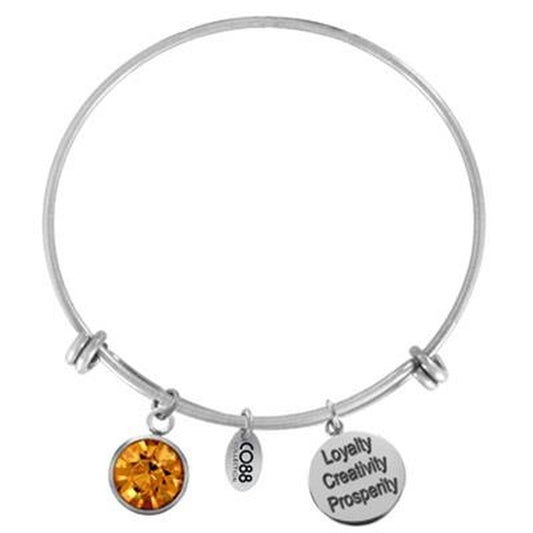 Zilverkleurige CO88 Collection armband met een gele steen en bedels met teksten.