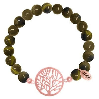 Elegante groene CO88 Collection armband met een opvallend boomdesign als sluiting.