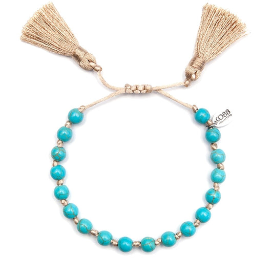 Blauwe CO88 Collection armband voor dames met elegante uitstraling en franjes.