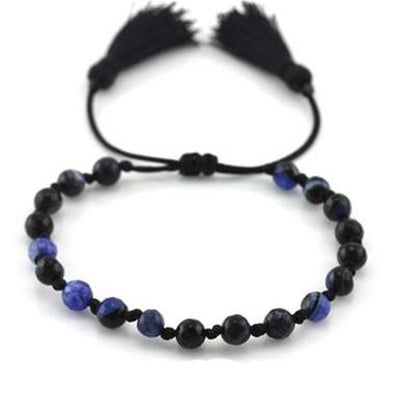 Zwarte CO88 Collection armband voor dames met elegante blauwe kralen en franjes.