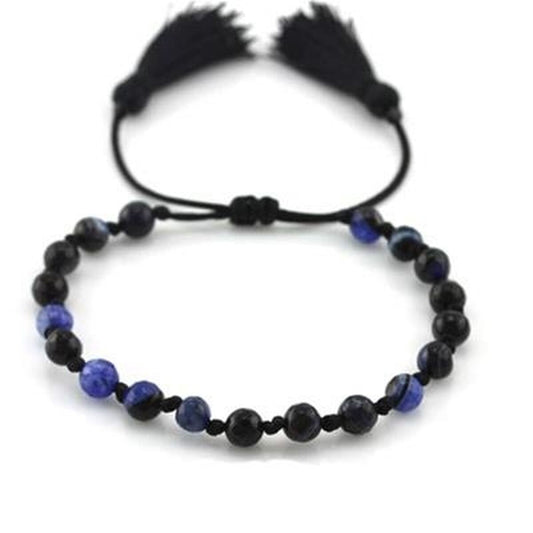 Zwarte CO88 Collection armband voor dames met elegante blauwe kralen en franjes.