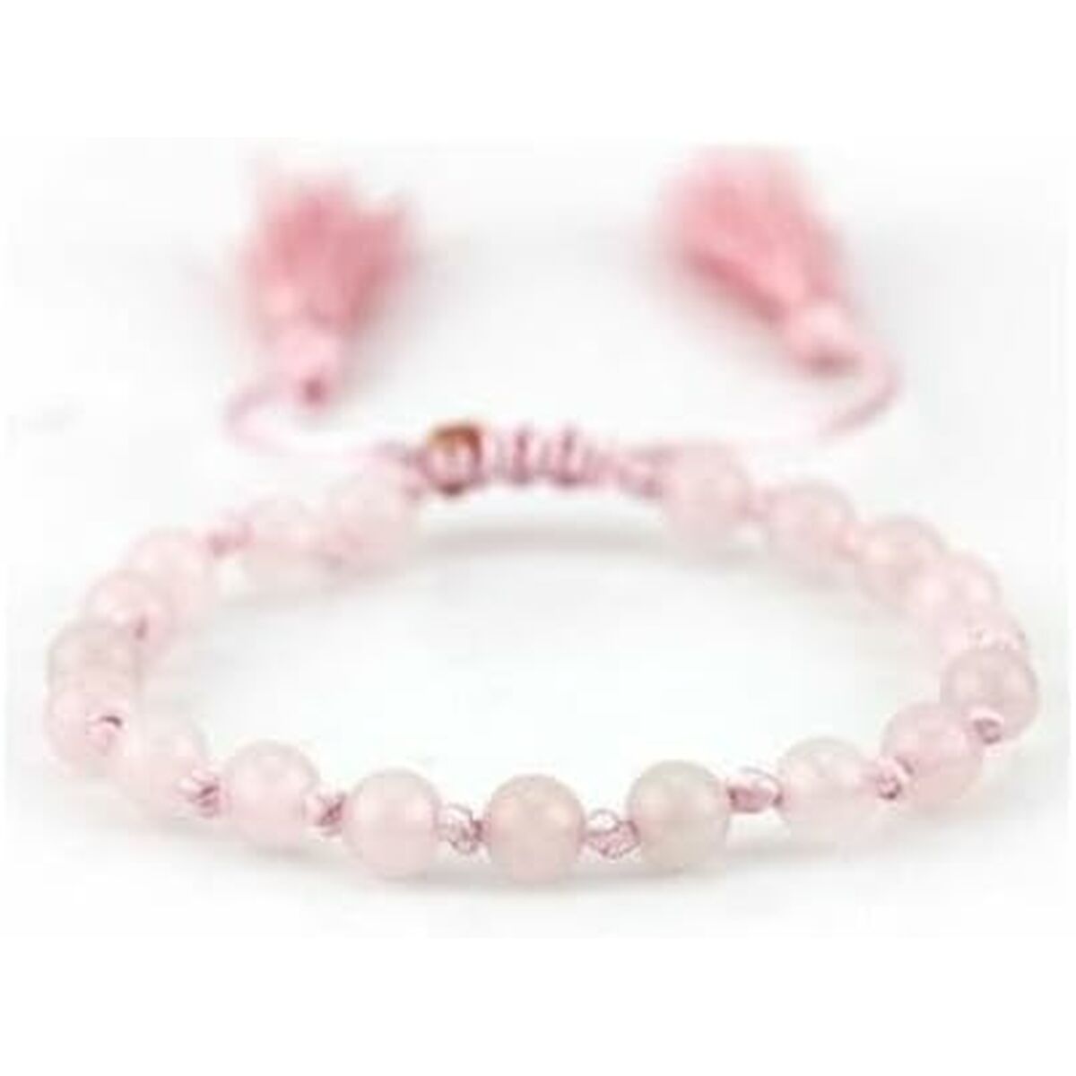 Detail van de roze CO88 Collection armband met ronde kralen en franjes.