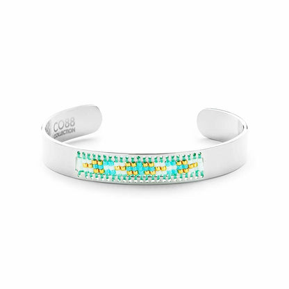 Zilverkleurige CO88 Collection armband met kleurrijke details in een elegante, open ontwerp.