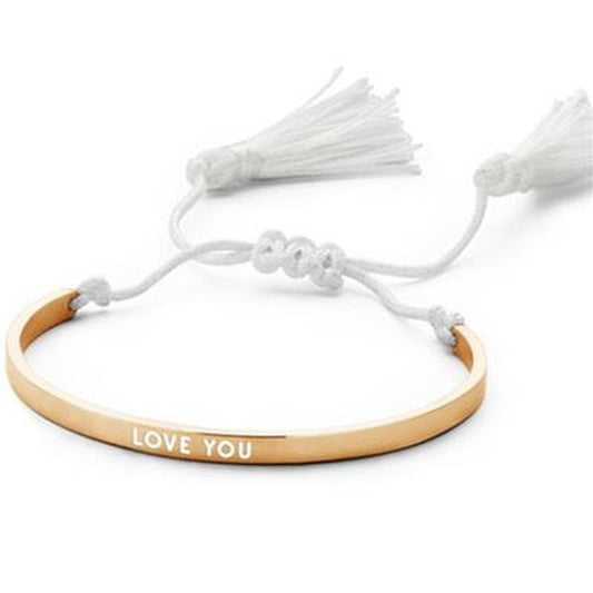 Gouden CO88 Collection armband met 'LOVE YOU' inscriptie en witte franjes.