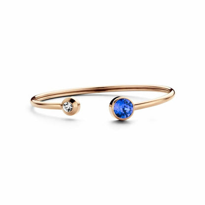 Detail van de CO88 Collection armband met blauw en roze gouden elementen.