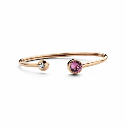 Detail van de CO88 Collection armband in roze goud met twee kleurrijke stenen.