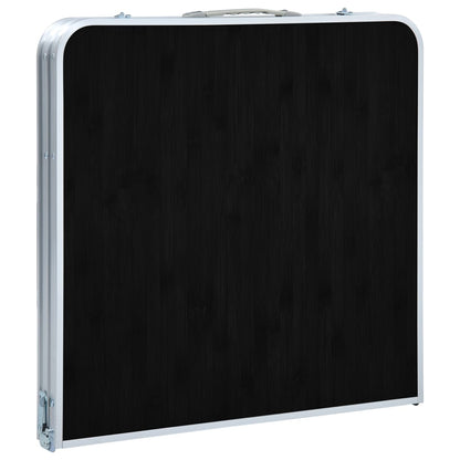 Zijaanzicht van de vidaXL inklapbare campingtafel in gesloten positie, met zwarte bovenkant en aluminium rand.