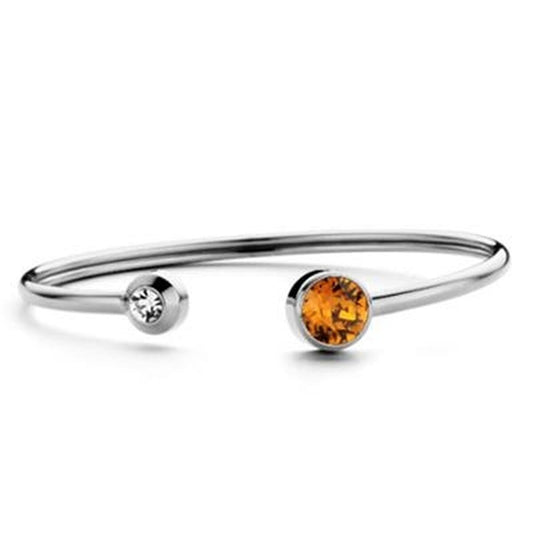 Zilverkleurige CO88 Collection armband met elegante stenen, open ontwerp.