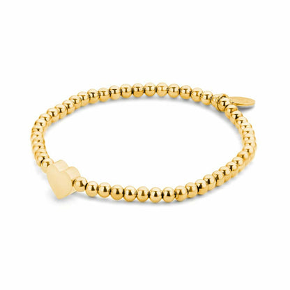 Close-up van de gouden CO88 Collection armband met een elegante hartvormige detail.