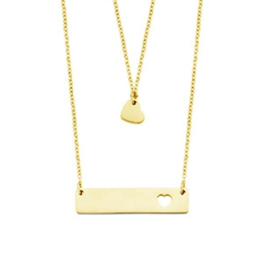Gelaagde CO88 Collection ketting met een elegante gouden kleur en hartvormig detail.