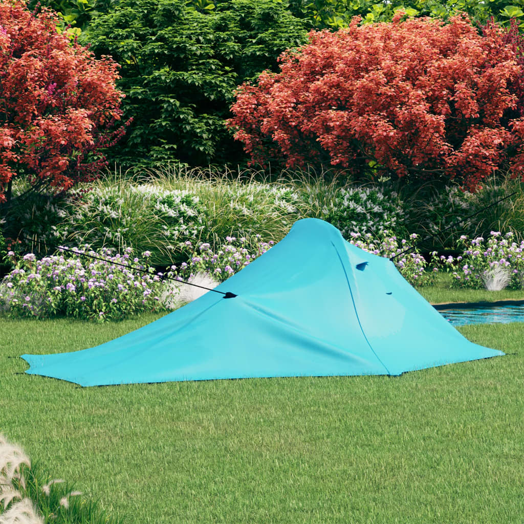 Lichtgewicht vidaXL tent in blauw, opzetbaar in een groene tuin.