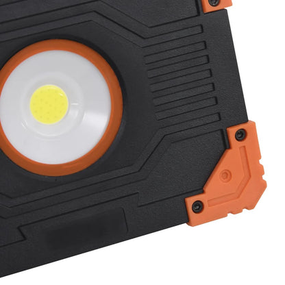 Detail van de vidaXL draagbare LED-spotlight met oranje accenten en witte lichtbron.