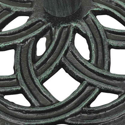 Detail van het gietijzeren patroon van de vidaXL parasolvoet in groen.
