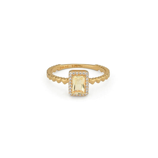 Gouden 24KAE ring voor dames met een exclusief design en een grote, elegante steen.