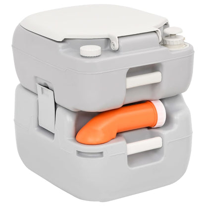 Detail van het vidaXL campingtoilet met oranje afvoersysteem en grijze behuizing.