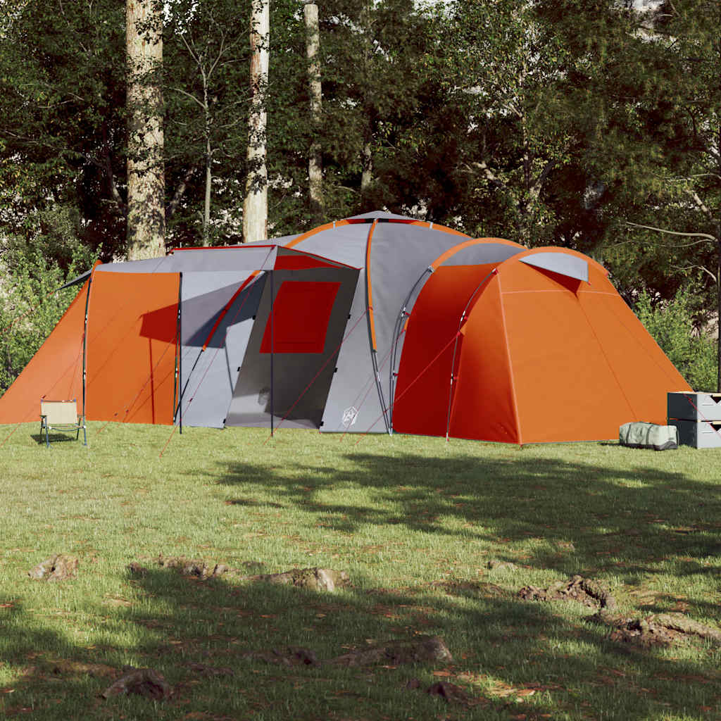 Zijaanzicht van de vidaXL koepeltent in grijs en oranje, opgesteld in de natuur.