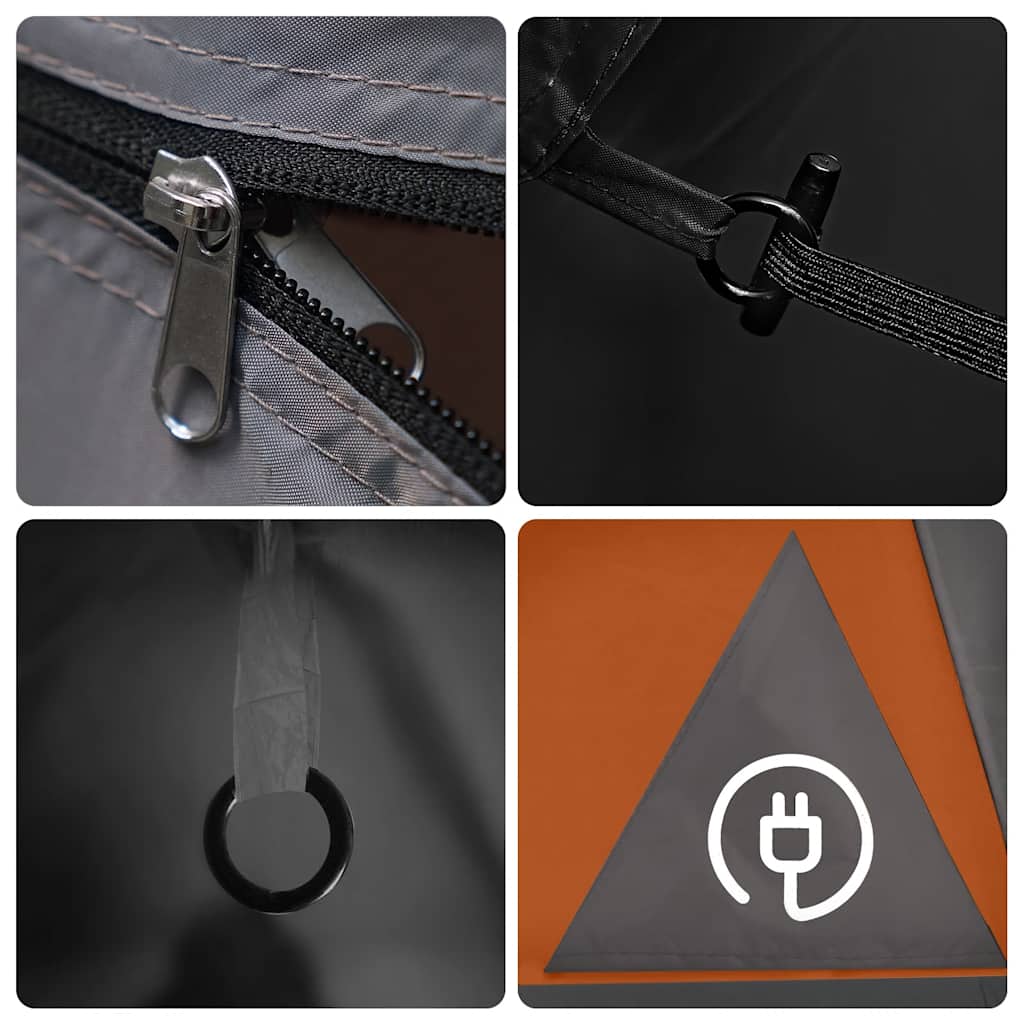 Detail van de grijze tent met oranje accenten, rits en bevestigingspunten.