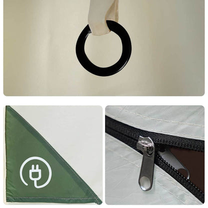 Detail van de tent met zwarte ring, groene hoek en rits voor waterdichte afsluiting.