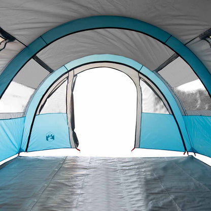 Zijaanzicht van de blauwe vidaXL tunneltent met open deur en gaasventilatie.