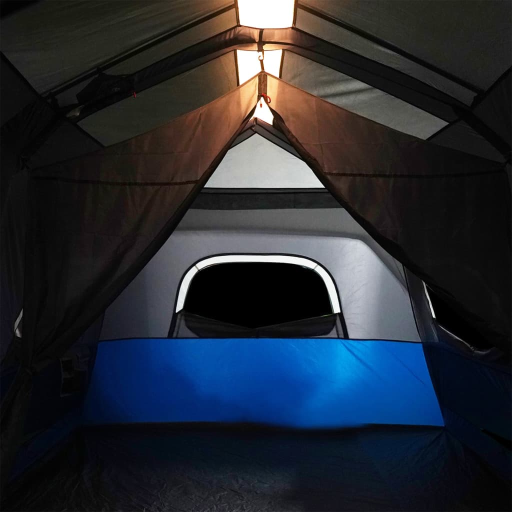 Binnenkant van de vidaXL 9-persoons tent met blauwe details en ingebouwde LED-verlichting.