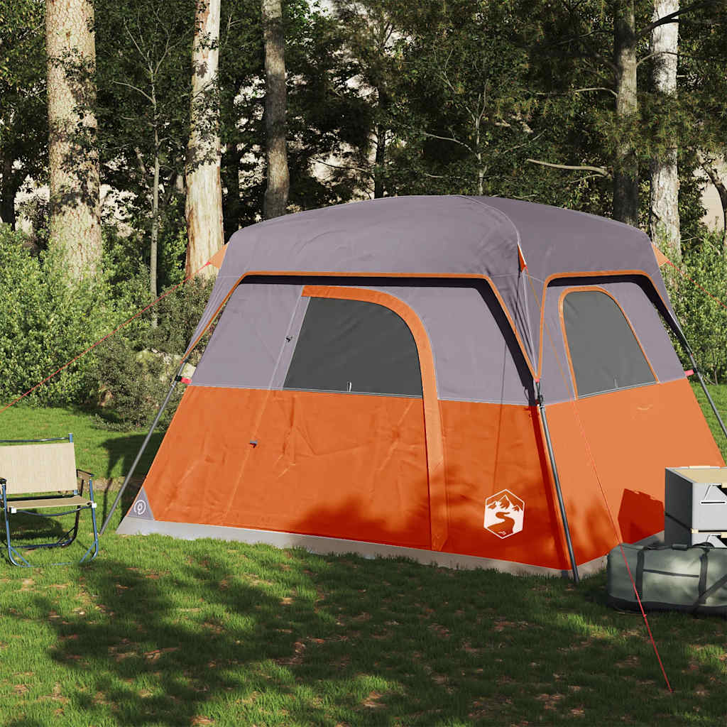 Zijaanzicht van de vidaXL 4-persoons tent in oranje met grijze accenten, geplaatst op gras.