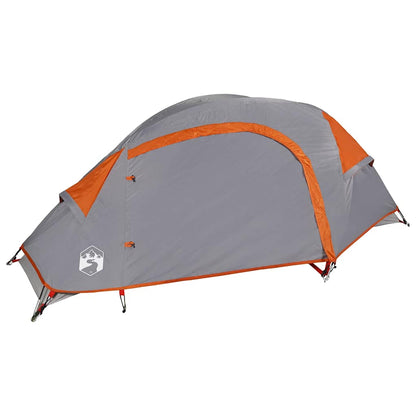 Zijaanzicht van de vidaXL 1-persoons koepeltent in grijs met oranje accenten.