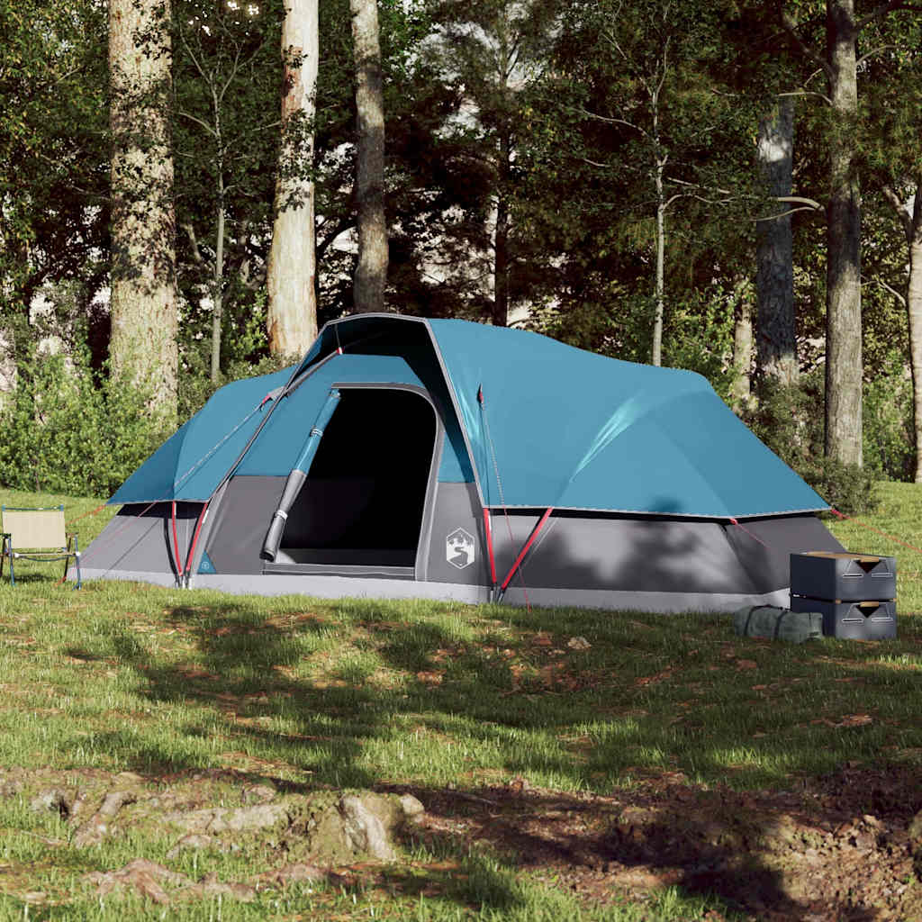 Zijaanzicht van de vidaXL koepeltent in blauw, opgesteld in een bosrijke omgeving.