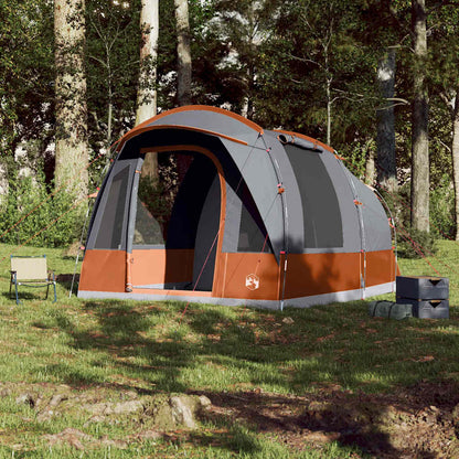 Zijaanzicht van de vidaXL 3-persoons tunneltent in grijs en oranje, opgesteld in de natuur.