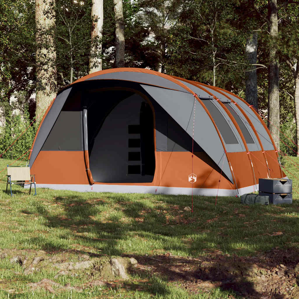 Zijaanzicht van de vidaXL tunneltent in grijs en oranje, opgesteld in een bosrijke omgeving.