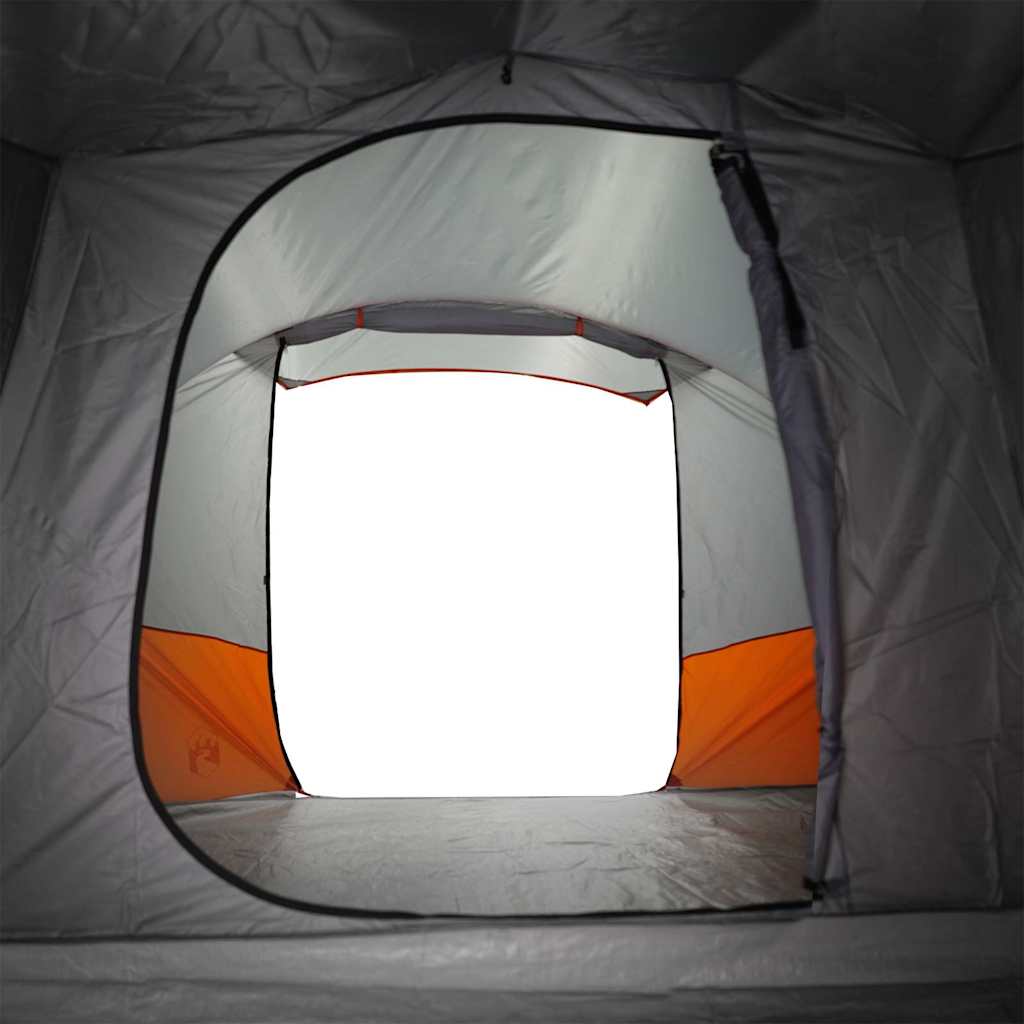 Detail van de ingang van de vidaXL tunneltent met oranje accenten.