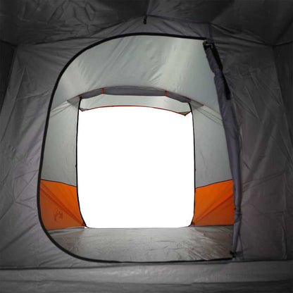 Detail van de ingang van de vidaXL tunneltent met oranje accenten.