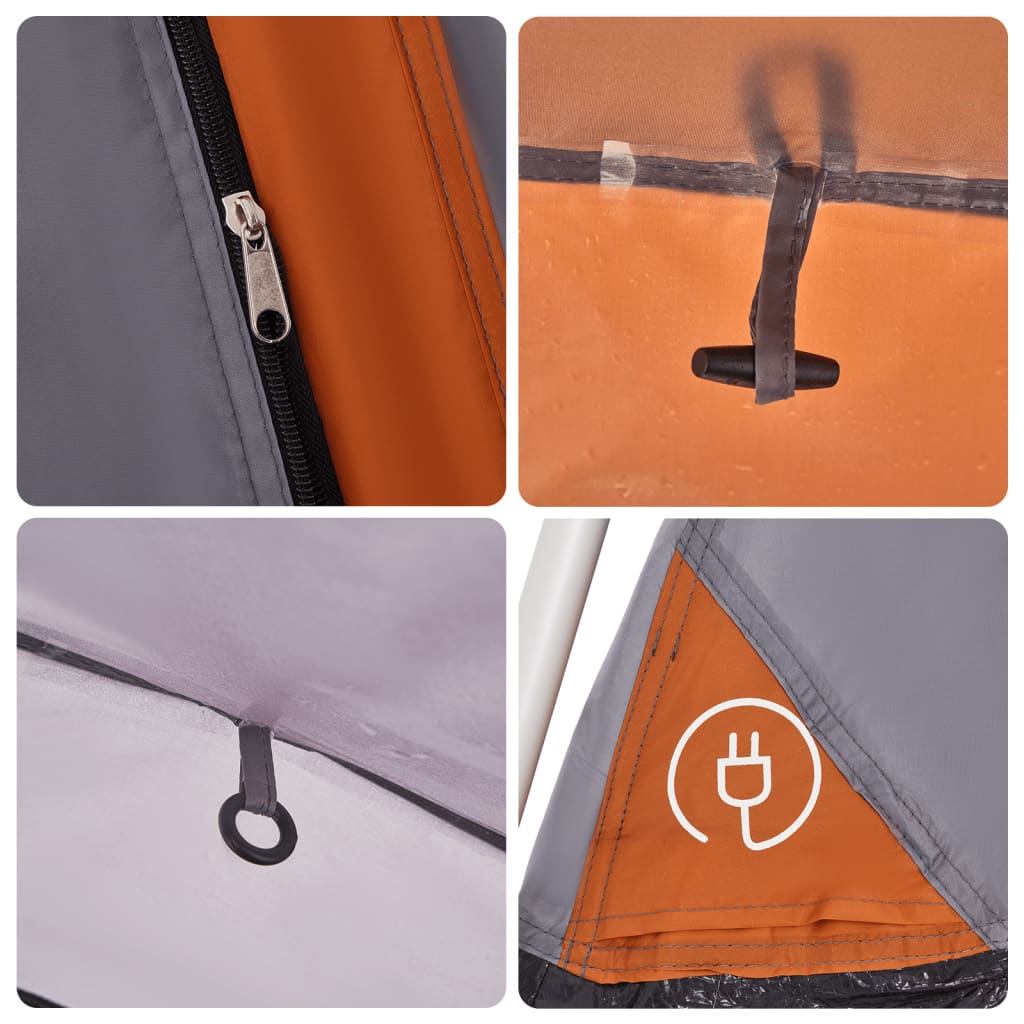Detail van de grijze en oranje tent met snelontgrendeling en waterdichte rits.