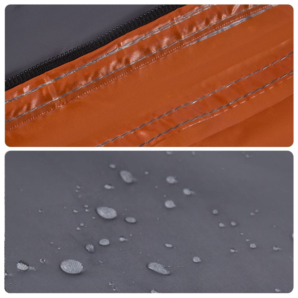 Detail van de grijze tentstof met oranje rits en waterdruppels op de PU-coating.