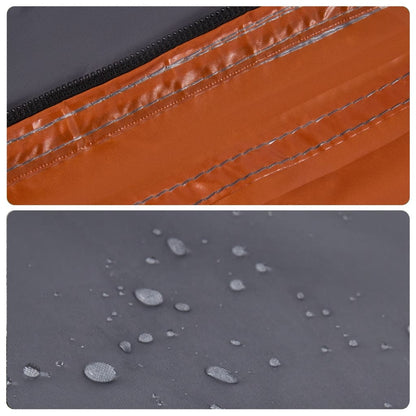 Detail van de grijze tentstof met oranje rits en waterdruppels op de PU-coating.