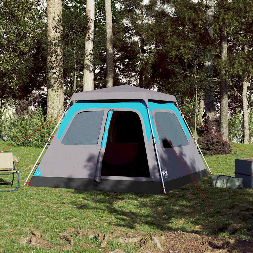 Zijaanzicht van de vidaXL koepeltent met blauwe details in een bosrijke omgeving.