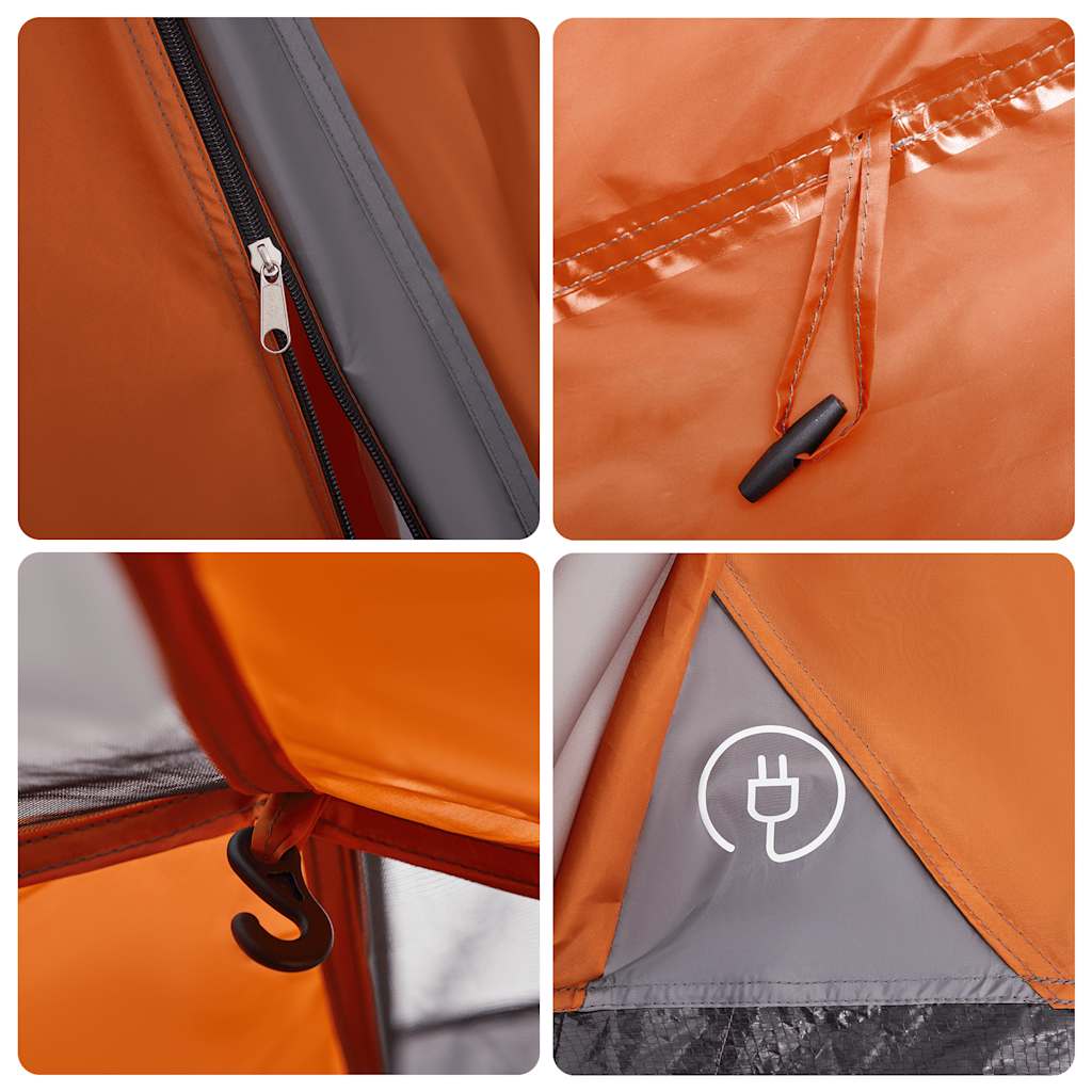 Detail van de grijze en oranje koepeltent met rits en haak voor bevestiging.