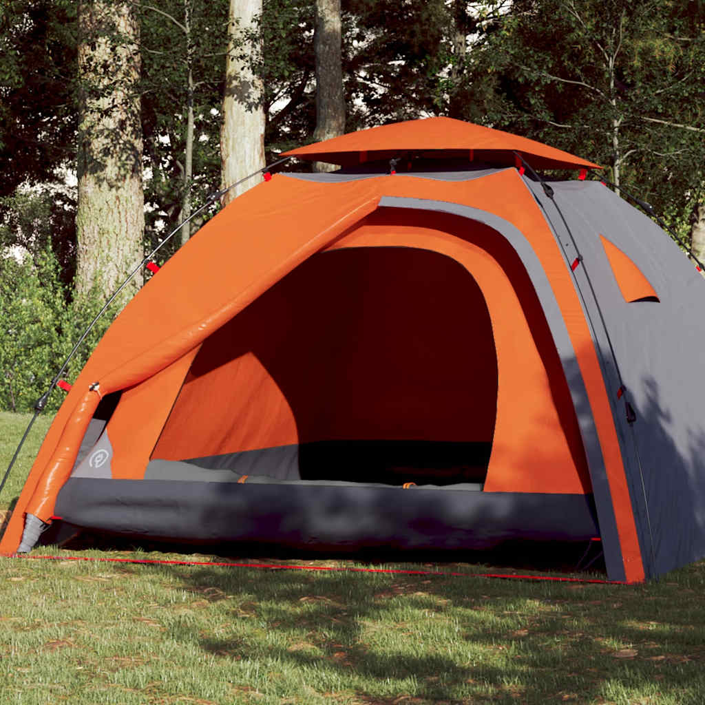 Koepeltent vidaXL 4-persoons in grijs met oranje details, geopend in een groene omgeving.