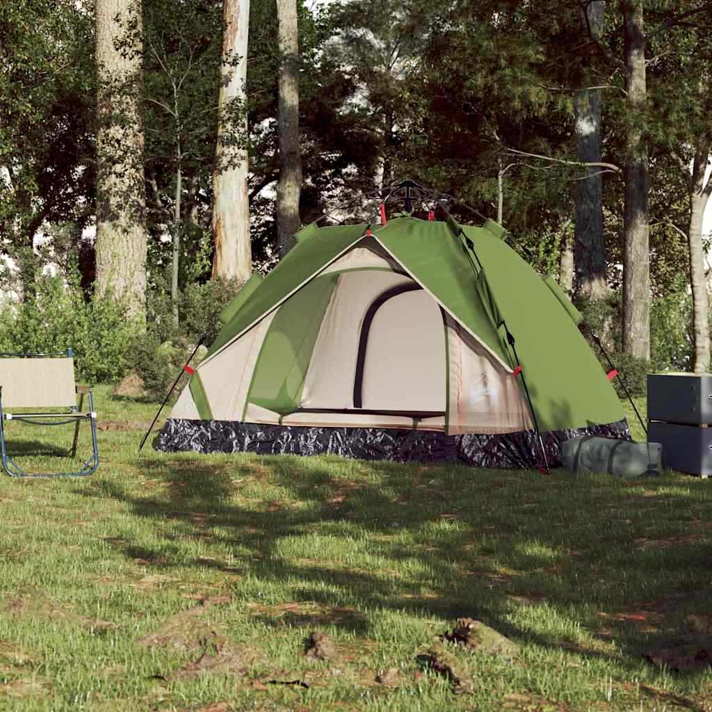 Zijaanzicht van de vidaXL koepeltent in groen, opgesteld op gras met campingstoelen.