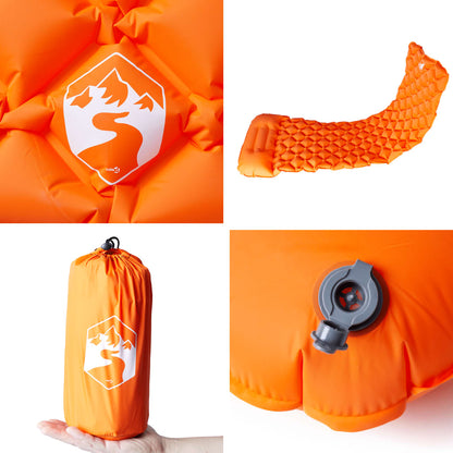Detail van het oranje vidaXL kampeermatras met kussen en ventiel.