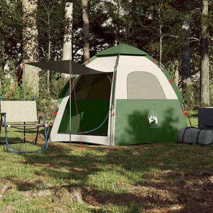 Detail van de vidaXL 4-persoons kampeertent in groen, met luifel en stoelen ernaast.