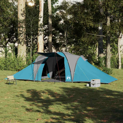 Zijaanzicht van de vidaXL koepeltent 6-persoons in blauw, opgezet in een bosrijke omgeving.